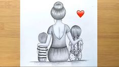 a drawing of a woman and two children with a red heart above her head on a wooden table