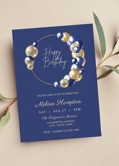 a blue and gold birthday party card with an image of pearls, beads and leaves