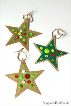 three star shaped christmas ornaments hanging from hooks on a white surface, each decorated with green and red polka dots