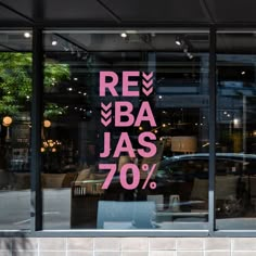 a storefront window with the words reba jas 70 % written on it