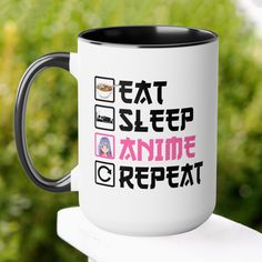 a black and white coffee mug with the words eat sleep and anime repeat on it