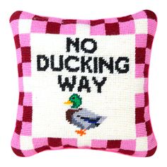 a pink and white pillow that says no ducking way with a duck on it