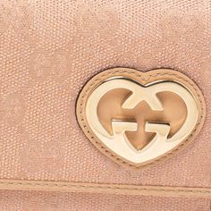 Gucci Beige/Pink Shimmer GG Canvas Lovely Heart Continental WalletA Gucci continental wallet is just what you need to own. It has been crafted from GG canvas as well as leather and styled with a GG heart. It comes with a leather and nylon lined interior that has multiple card slots a zipped coin pocket and an open compartment for you to neatly arrange your cash and bills. Size: Height: 9.5 cm Width: 3 cm Length: 19 cmColour: BeigeMaterial: Canvas Wallet Gucci, Colour Beige, Own It, Hermes Bags, Timeless Handbag, Wallet Fashion, Winter Sale, Buying Gifts, Dior Bag