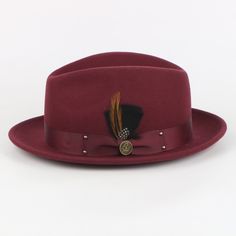 The Ayden Fedora offers a timeless and sophisticated style, blending vintage charm and modern appeal. Its intricate design is carefully crafted with precision and care, complete with a Matching Satin Grosgrain Band and a hand-crafted feather bundle.   Brim: 2 “(Snap Brim) Crown Height: 4.8 inches (Center Dent) Shape: Fedora, Crushable Material: 100% Fine Australian Wool Band: Satin Grosgrain 1.5 Interior: Satin Lining with Cotton Moister Wicking Sweat Band Removable SL Logo Pin Complementary Hat Sl Logo, Bow Tie Pants, Crystal Dress, Logo Pin, Crown Heights, Hat Boxes, Pin Logo, Hat Box, Black Shirt Dress