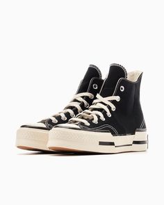 Converse Chuck Taylor All Star 70 Plus HI Top Sneaker Style#: A00916C Black / White Size: Mens 7.5 US / 7.5UK / 41EU / Womens 9.5 US An unexpected update on an all-time classic, the Chuck 70 Plus mixes iconic features with future-forward styling. A fusion of mixed-weight canvas comes together with bold, asymmetrical lines for a statement-making look. Spliced rubber and ankle patch details keep all eyes on you, while premium cushioning helps you stay light on your feet. High-top sneaker with canvas upper OrthoLite cushioning for all-day comfort An asymmetrical, fused design and elongated tongue for standout style A split rubber outsole distorts heritage Chuck Taylor design elements A spliced Chuck Taylor ankle patch Imported *shoe box and shoe trees not included* Modern Black Converse Sneakers, Modern Black Sneakers With Rubber Toe Cap, Chuck 70 Plus, Chuck Taylor Black, Sneaker Style, New Converse, Converse Chuck 70, Shoe Tree, Chuck 70