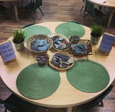 a table topped with bowls filled with plants