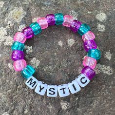 Mystic Purple, Pink & Blue Bead Bracelet Osfm Nwt *1 Bead Bracelet That Says Mystic With Purple, Pink And Blue Beads *One Size Fits Most *Handmade *New Bundle & Save... Reasonable Offers Welcome! Check Out Our Other Handmade Bracelets And More! Handmade Spiritual Purple Beaded Bracelets, Purple And Blue Beaded Bracelets, Bohemian Purple Beaded Bracelets With Letter Beads, Pink Purple Blue Beaded Bracelet, Playful Purple Beaded Bracelets, Spiritual Purple Stackable Bracelet, Bead Friendship Bracelet, Blue Bead Bracelet, Travel Charm Bracelet