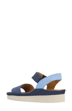 A denim upper lends trend-savvy appeal to a slingback sandal lifted by a subtle platform and integrated wedge heel. 1 3/4" heel; 1 1/2" platform Adjustable strap with hook-and-loop closure Memory foam cushioning with arch support Textile upper/leather lining/synthetic sole Imported Casual Wedge Heel Slingback Sandals, Casual Blue Slingback Heels, Casual Blue Slingback Sandals With Open Heel, Casual Blue Open Heel Slingback Sandals, Blue Slingback Sandals With Removable Insole, Blue Denim Sandals With Removable Insole, Blue Wedge Heel Sandals With Arch Support, Casual Blue Sandals With Heel Loop, Denim Platform Wedge Sandals With Open Toe