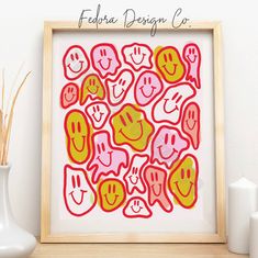 an art print with many different emoticions in red, yellow and pink colors