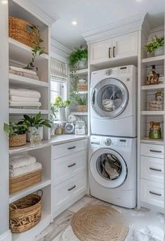 a washer and dryer in a white laundry room with open shelvings