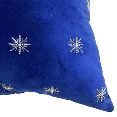 a blue pillow with snowflakes on it