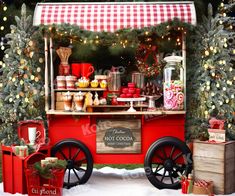 an old fashioned hot dog cart with christmas decorations