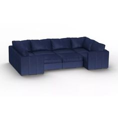 a blue sectional sofa with pillows on the top and bottom, sitting in front of a white background