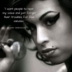 a woman holding a microphone in her right hand and looking at the camera with a quote on it