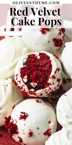 red velvet cake pops with white frosting and sprinkles in the middle