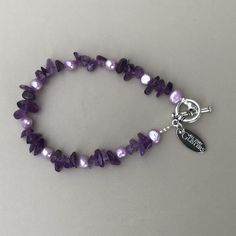 "This beautiful Amethyst & Freshwater Pearl Bracelet is designed and made in Ireland. The toggle clasp is pewter. The bracelet is 8\" in length, is made on wire and has a toggle clasp. The bracelet can be made longer or shorter. There are also matching necklace options." Purple Metal Bracelets As Gift, Purple Metal Bracelets As A Gift, Purple Metal Beaded Bracelet As Gift, Purple Metal Beaded Bracelets As Gift, Adjustable Purple Pearl Bracelet As Gift, Personalized Purple Bracelet Jewelry, Purple Pearl Bracelet As Gift, Purple Metal Charm Bracelet For Gift, Purple Metal Charm Bracelet Gift