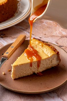 a slice of cheesecake with caramel sauce being drizzled over it