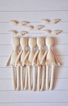 a group of wooden dolls standing next to each other