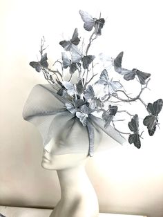 "Silver Fascinator- Horse Racing style- Kentucky Derby- Derby Day- Wedding- Ladies Luncheon Hello, This fascinator is the one that is shipping. Ships in 1 business day! This fascinator is made with silver butterflies that are 3\"wide. They are perched on gold branches that are plastic that are painted and will not break as natural ones would. Its all placed on a netting that is a 14\" circle. It is attached to a satin covered skinny headband and is adjustable. It's very comfortable and will fit Silver Fitted Fascinator For Evening, Silver Fascinator For Kentucky Derby Races, Silver Fitted Fascinator For Wedding, Silver Evening Fascinator For Kentucky Derby, Silver Fascinator For Evening At Kentucky Derby, Silver Headpiece For Evening At Royal Ascot, Silver Evening Headpiece For Royal Ascot, Silver Fitted Headpieces For Formal Occasions, Silver Fascinator For Wedding