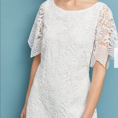 Beautiful, Popular Charleston Lace Mini Dress From Anthropologie. From The Office To A Summer Soiree To A Bridal Or Wedding Party, This Versatile White Lace Dress Makes An Elegant Statement At Any Occasion. White Shift Style Mini Dress With Beautiful, Intricate Floral Embroidered Lace. Scalloped Hem. Short Sheer Sleeves; Wide Boat Neck. Hidden Zipper At Side. Polyester; Rayon Lining. Retail: $240. New Without Tags Summer Sheath Dress For Mother Of The Bride, Summer Lace Dress For Mother Of The Bride, Chic Summer Dress For Mother Of The Bride, Feminine Mother Of The Bride Summer Dress, Summer Sheath Dress With Lace Sleeves, Summer White Dress For Mother Of The Bride, Lace Sheath Dress For Brunch, Mini Dress Plus Size, Summer Soiree