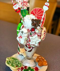 an ice cream sundae decorated with candy and candies