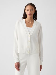 Soft, textured cotton slightly cropped cardigan.  V-neck.  Long sleeves with banded cuffs.  Button front.  Banded hem.  * Fit: Relaxed.  A straight & easy fit.  * Style Note: For a more Classic fit, go down one