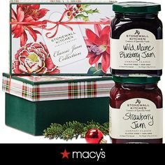 two jars of wild more blueberry jam next to a holiday box with holly and poinsettis