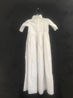 "Beautiful antique christening gown with beautiful details of pintuck pleats, open cutwork, embroidery, and embroidered lace. Ruffled neckline, long gathered skirt, buttons in the back. Incredible condition with no issues. Notably well cared for and preserved for many decades. label: none; most likely handmade fabric: feels like all cotton size: none listed. Please check measurements for an accurate fit. Questions are welcome! Dress was measured while lying flat across the front seam to seam: un Classic Fitted Baptism Dress With Broderie Anglaise, Historical Cotton Wedding Dress, Embroidered Fitted Cotton Baptism Dress, White Cotton Baptism Gown, Fitted Cotton Gown For Baptism, Long Gathered Skirt, Pintuck Pleats, Vintage Toddler, Christening Gown