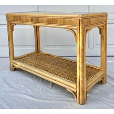 a wooden table with a shelf made out of bamboo