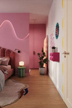 a bedroom with pink walls and wooden flooring next to a bed in the corner