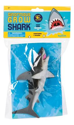 a toy shark with its mouth open and teeth out