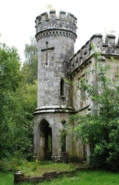 an old stone castle with a cross on it