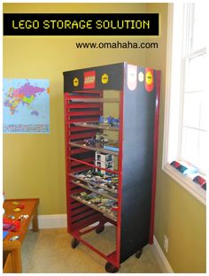 a toy storage unit in a child's room with legos on the shelves