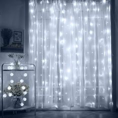 a room with a window covered in white lights