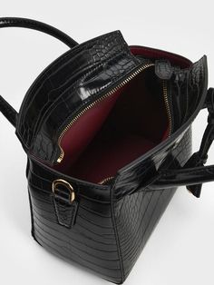 Luxurious and functional, this Harper top handle bag with a croc-effect finish will easily become a new favourite that you will reach for again and again. Whether you are headed to work, evening events or a special occasion, it will be a fabulous style companion. Plus, in black, it will always be a failproof choice that will match with everything in your wardrobe - perfect for days when you want to look classy with effortless ease. Structured Top, Fabulous Style, Look Classy, Size Chart For Kids, Charts For Kids, Charles Keith, Printables Kids, Black Tote Bag, Handle Bag