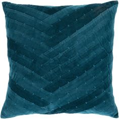 a teal colored pillow with wavy lines on the front and back, made out of velvet