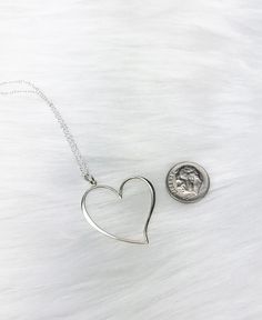 No matter how much I say I love you, I always love you more than that.Happy Valentine's Day Give your sweetheart a gift that she can cherish this Valentine's Day. An oversized sterling silver heart outline charm pendant comes on a 24" length sterling silver cable chain necklace. (This chain is longer, hitting about mid-chest on most adult females when worn) Comes in a jewelry box tied with ribbon. Sending this directly to someone? Be sure to include a note during the checkout process in the 'not Friend Soulmate, To My Valentine, Heart Outline, Sterling Silver Heart Necklace, Large Heart, Loving Memory, Silver Heart Necklace, Romantic Valentine, Valentines Gifts For Her