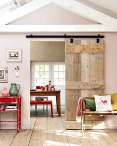 an open door leading to a living room and dining area