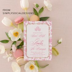 an image of wedding stationery with flowers and macaroons