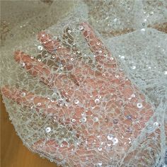 Welcome to our little shop. (^_^)Super beautiful lace fabric with sequins and beads in ivory for sale 2019 new collection. Wide : 130cm.  Price is for 1 yard long.We will ship in one piece continue without cutting if you order more than 1 quantity.Very elegant and romantic. It is widely use for bridal bolero, wedding gowns, bridal dresses, fashion costume, skirts, curtains, home decor and etc...We offer special discounts for designers and wholesale orders!About the shipping,If you select shippin Tulle Embroidery, Beaded Lace Fabric, Bridal Lace Fabric, Embroidered Lace Fabric, For Wedding Dress, Bridal Fabric, Wedding Dress Fabrics, Corded Lace, Lace Bridal Gown