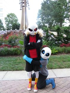 two people in costumes are hugging each other