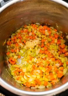 the food is being cooked in the pot on the stove