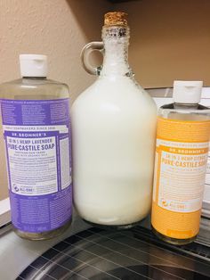 three different types of soaps are sitting on the counter