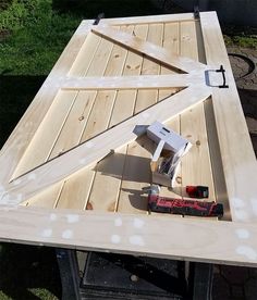 an overhead view of a table with tools on it and some grass in the background