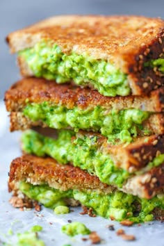 avocado grilled cheese is stacked on top of each other, with the title above it