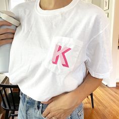 Look stylish and unique in this personalized comfort colors pocket tee. It features a shadow block initial embroidered design that is sure to make you stand out. Get ready to turn heads with this vibrant and colorful design! Sample shown on White with Pink thread. Features:  100% ring spun cotton, 30 singles Garment dyed for that lived in feel and almost no shrinkage at home. Soft ring spun cotton fabric with 100% cotton threads Relaxed fit Topstitched, classic width, rib collar Shoulder to shou Educator Gifts, Pink Thread, Wedding Engagement Gifts, Bachelorette Gifts, Loungewear Sets, Pocket Tshirt, Look Stylish, Colorful Design, Fall Shopping