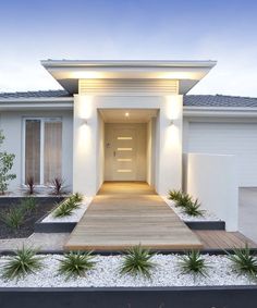 a modern house with green front door