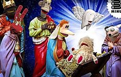 the nativity scene is depicted with three wise men and two sheeps, one holding a baby jesus