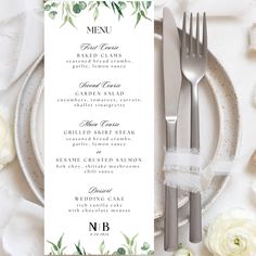 the menu card is set on top of a plate with silverware and white roses