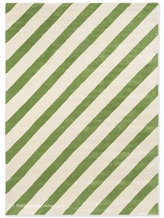 a green and white rug with vertical stripes